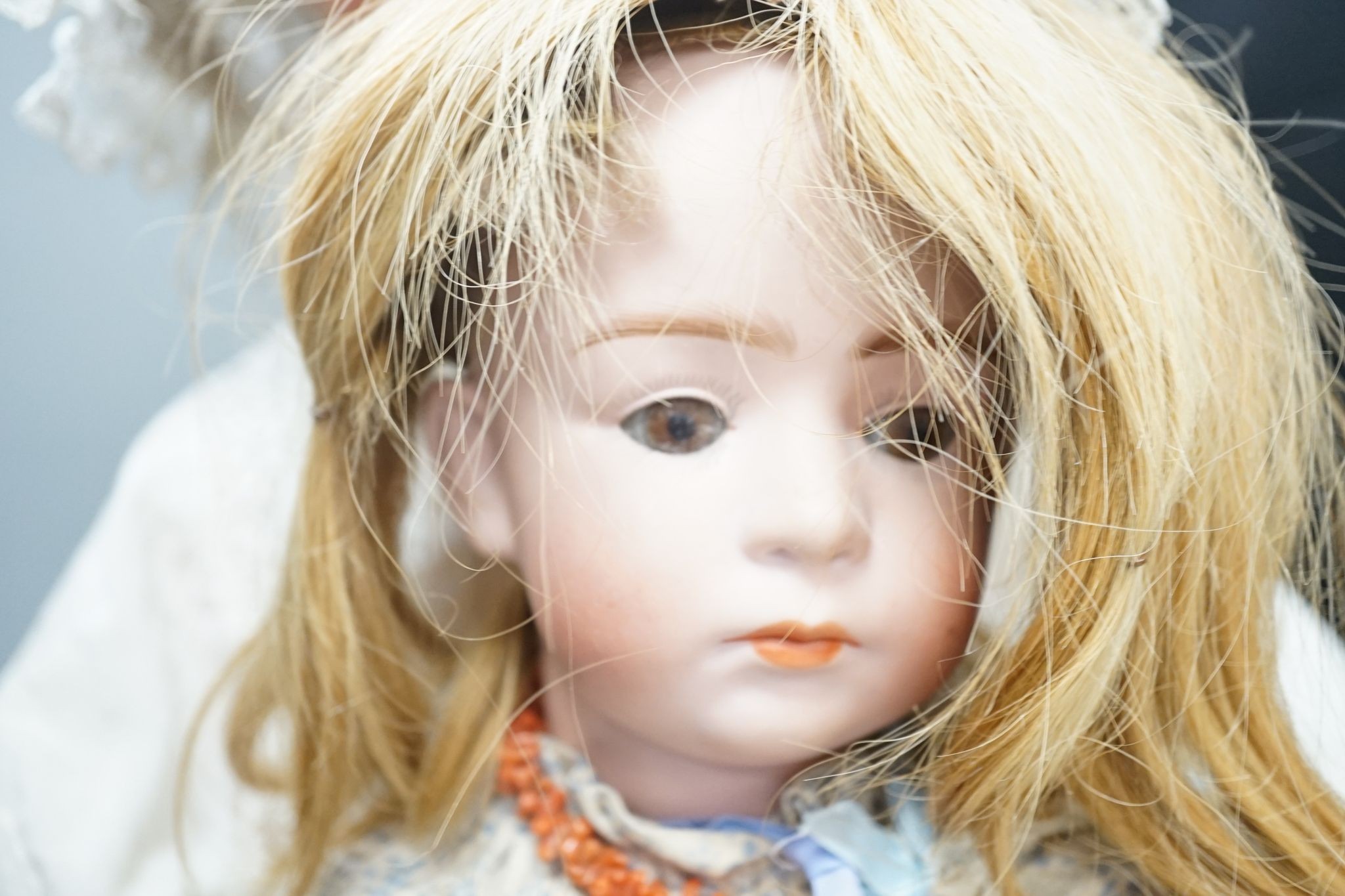A German Porzellanfabrik Burggrab bisque headed doll, one other bisque headed doll